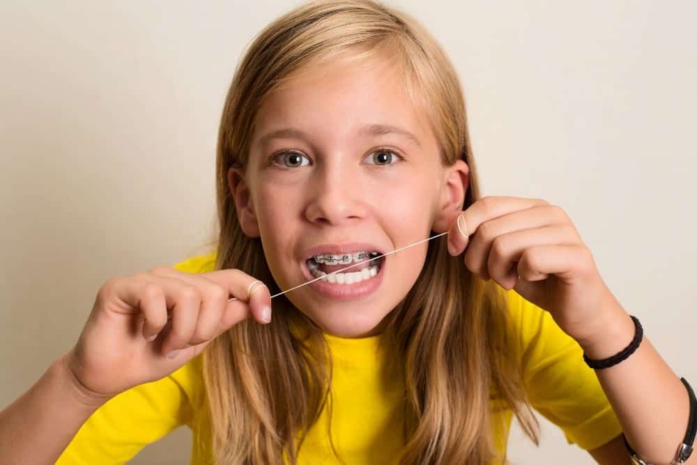 Discover whether flossing or brushing comes first from an orthodontist in Parkersburg WV